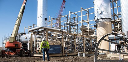 A person standing next to a construction site
